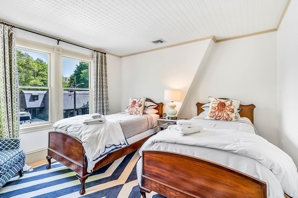 44 Derby Street Concord, MA 01742 - Photo 17 of 23 a bedroom with bed and a large window