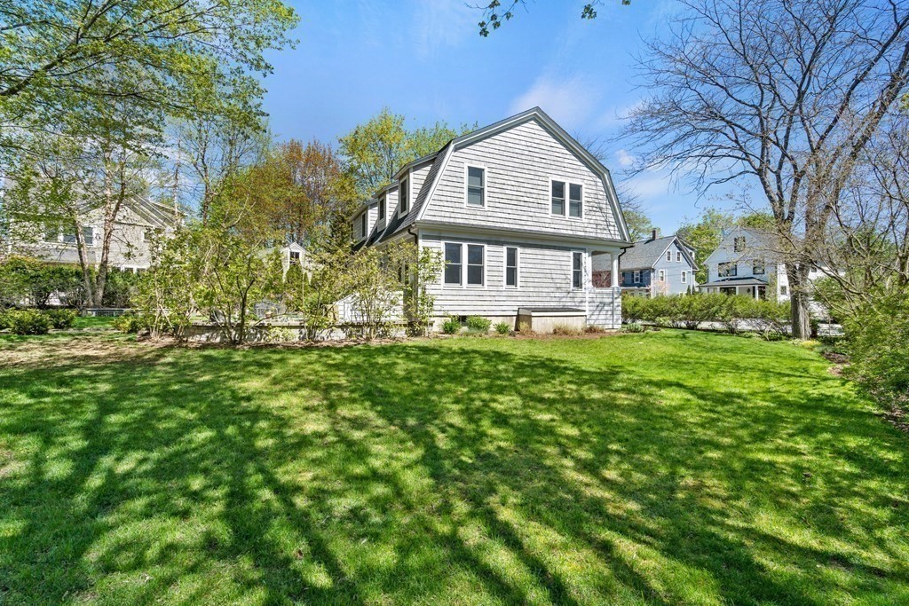 44 Derby Street Concord, MA 01742 - Photo 20 of 23 a front view of a house with a yard