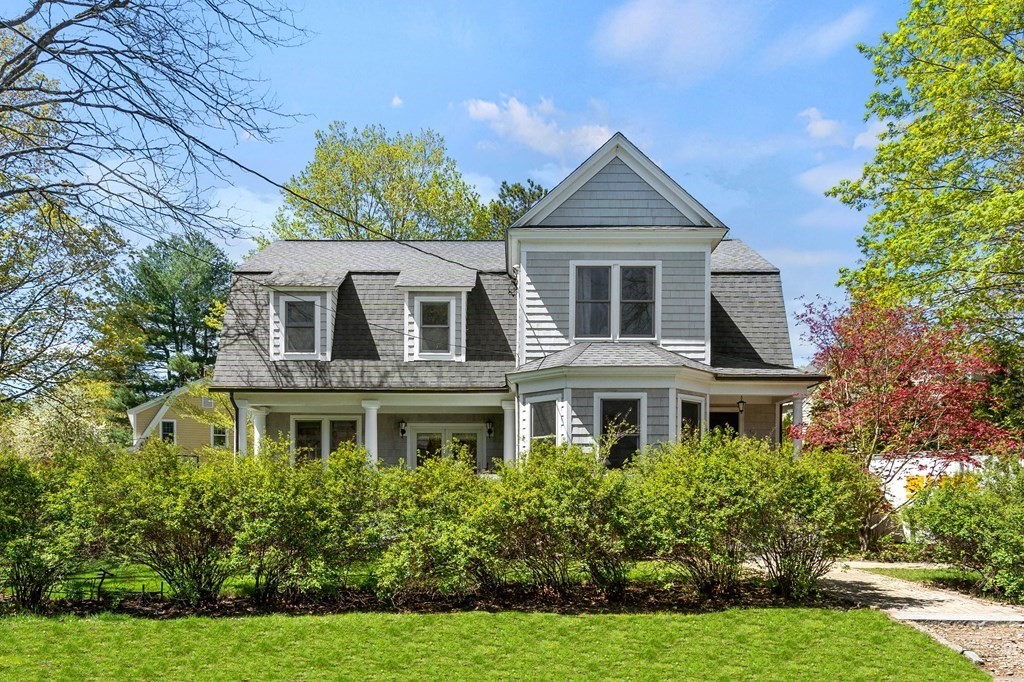 44 Derby Street Concord, MA 01742 - Photo 2 of 23 a front view of a house with a yard