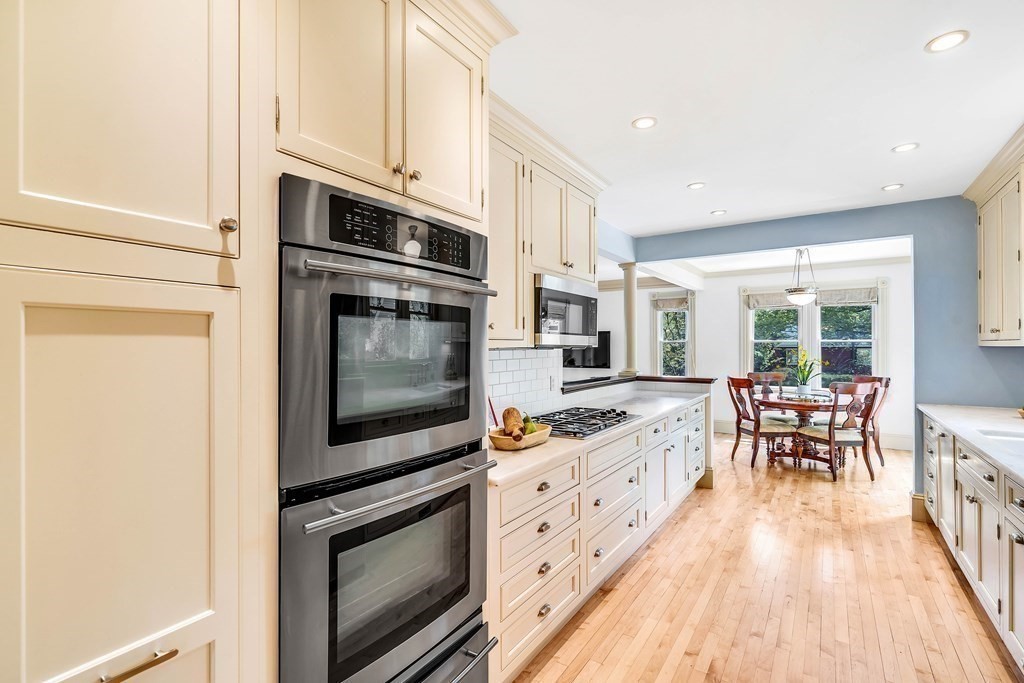 44 Derby Street Concord, MA 01742 - Photo 6 of 23 a kitchen with stainless steel appliances granite countertop a stove and a microwave