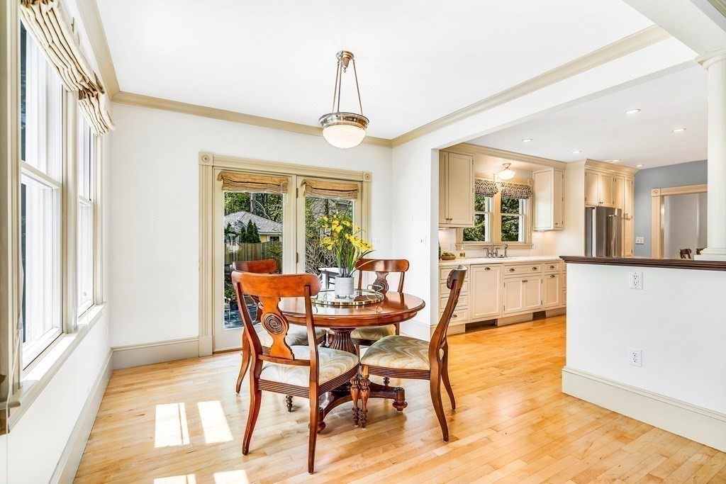 44 Derby Street Concord, MA 01742 - Photo 7 of 23 a dining room with furniture a chandelier and wooden floor