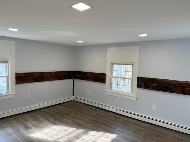 a bathroom with a granite countertop sink and vanity