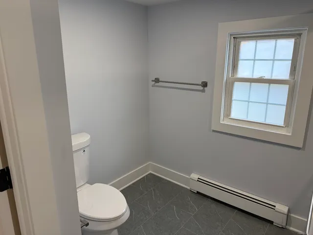 a bathroom with a shower and a sink