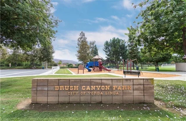 a view of a park with iron fence