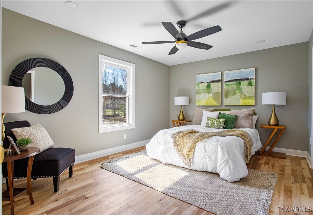 8001 Courthouse Road Providence Forge, VA 23140 - Photo 17 of 28 a spacious bedroom with a bed a window and a chandelier