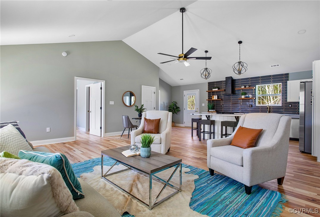 8001 Courthouse Road Providence Forge, VA 23140 - Photo 9 of 28 a living room with furniture kitchen view and a chandelier