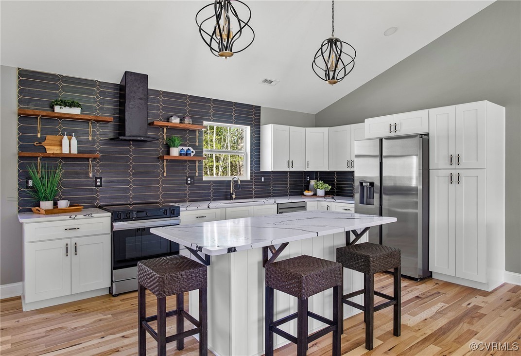 8001 Courthouse Road Providence Forge, VA 23140 - Photo 10 of 28 a kitchen with stainless steel appliances a stove a refrigerator and a table