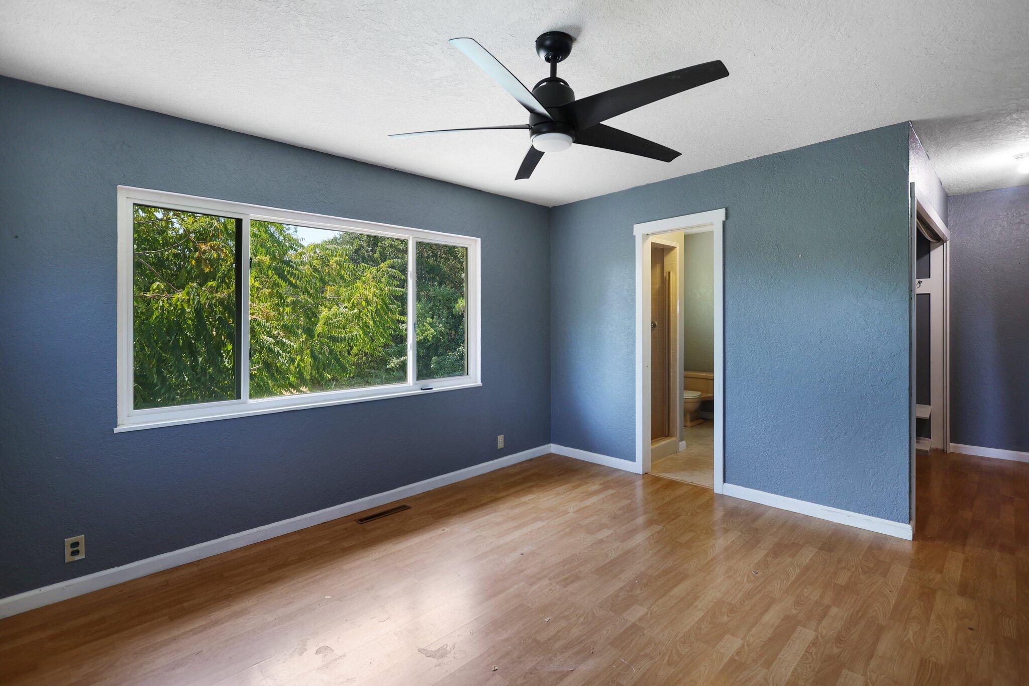 665 Overhill Drive Redding, CA 96001 - Photo 14 of 35 wooden floor in an empty room with a window