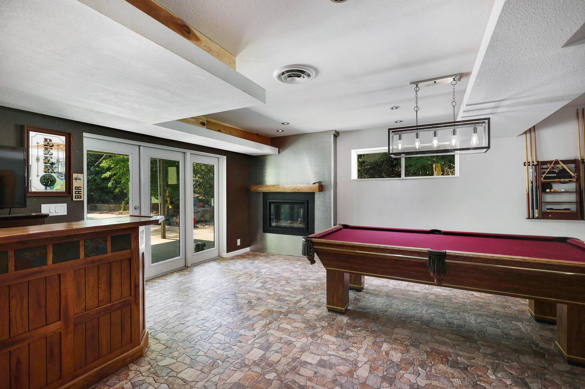 665 Overhill Drive Redding, CA 96001 - Photo 24 of 35 a room with furniture pool table table and chairs