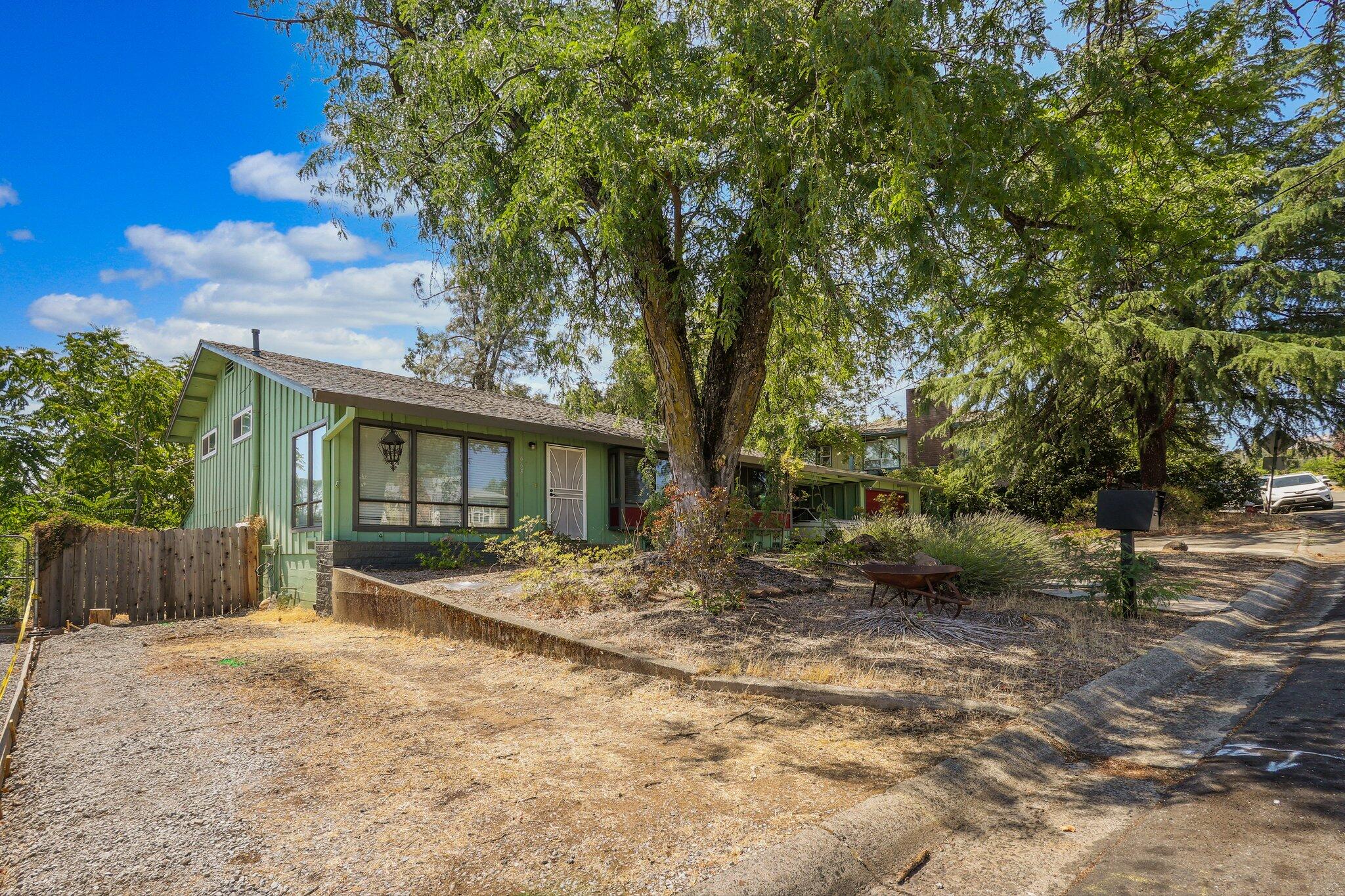 665 Overhill Drive Redding, CA 96001 - Photo 3 of 35 a view of a house with a yard
