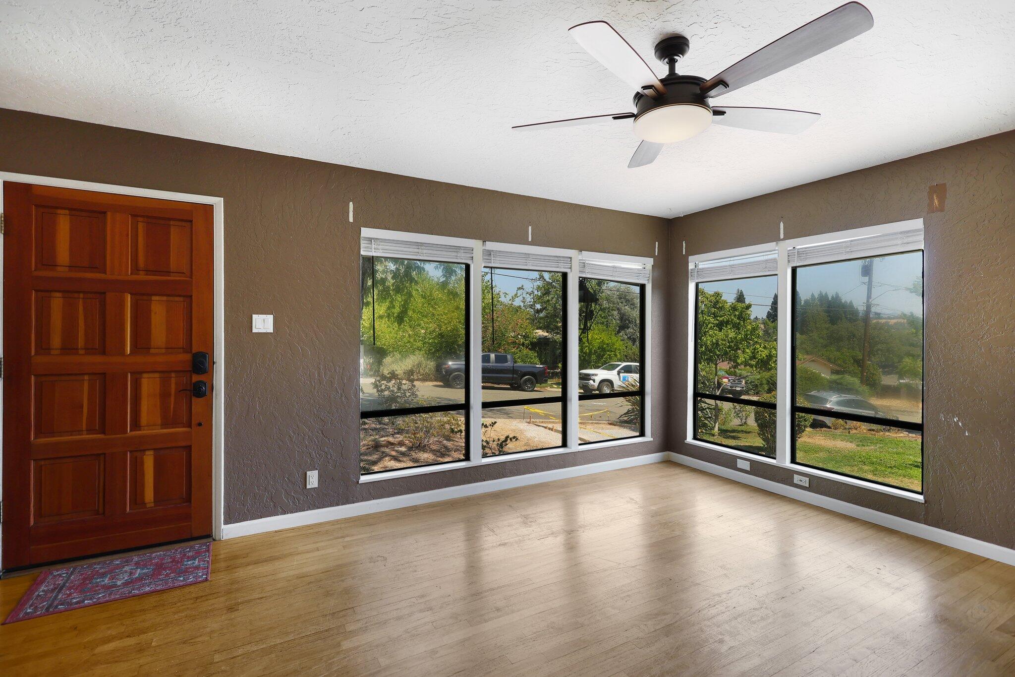 665 Overhill Drive Redding, CA 96001 - Photo 7 of 35 a view of empty room with wooden floor and fan