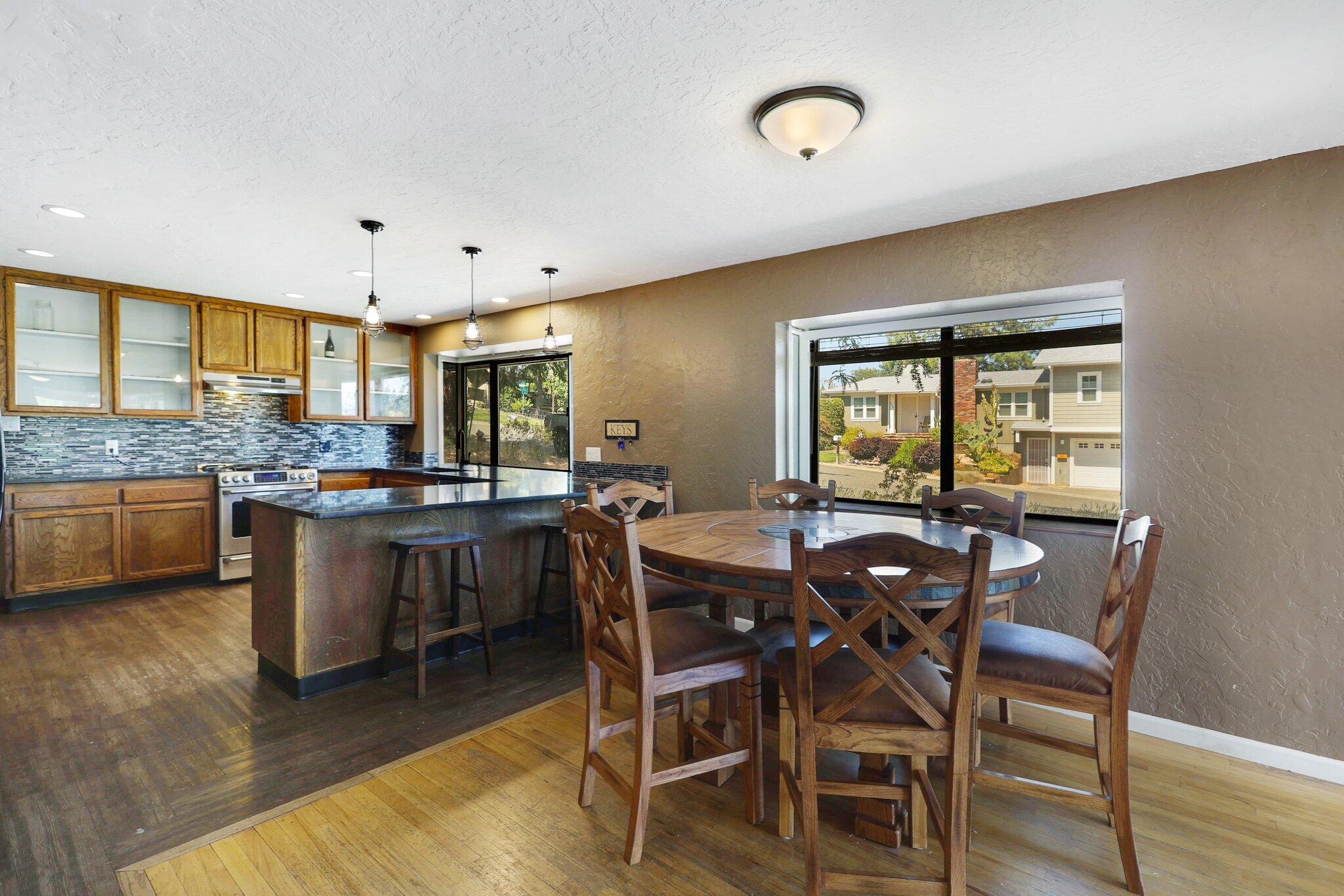 665 Overhill Drive Redding, CA 96001 - Photo 9 of 35 a view of a dining room with furniture and wooden floor
