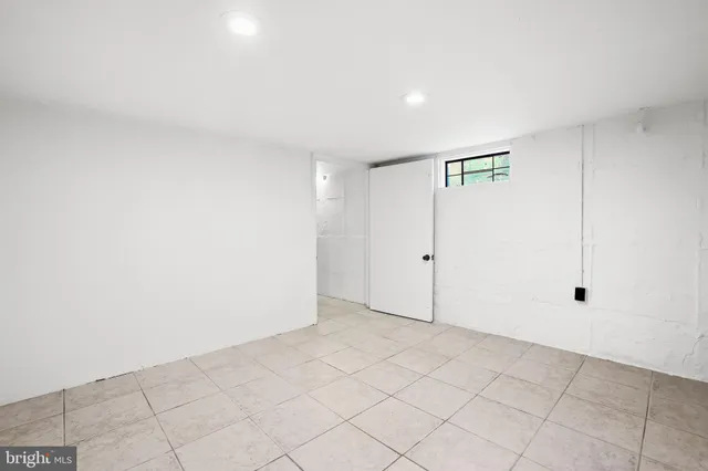 a street view with tall buildings and cars parked on the street