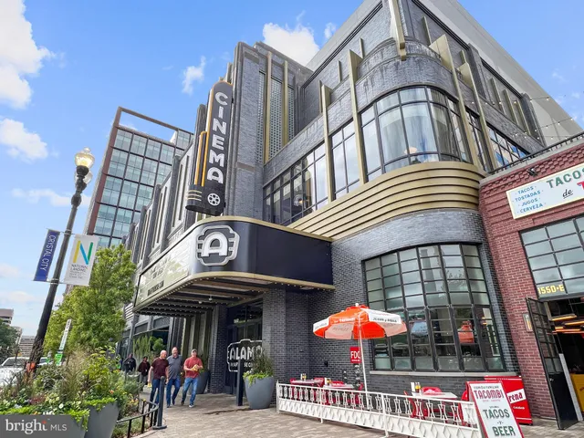 a view of a bench in front of a building