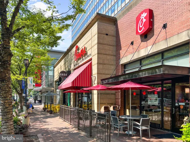 a view of a cafe with sitting area
