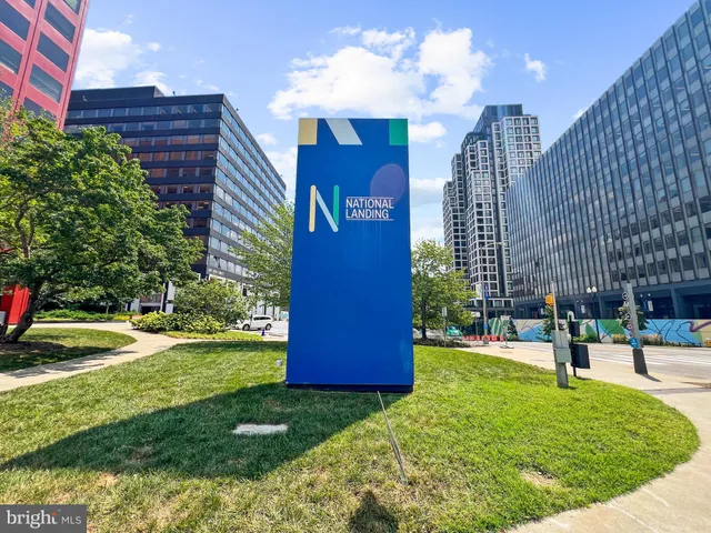 a view of a cars park in front of a building