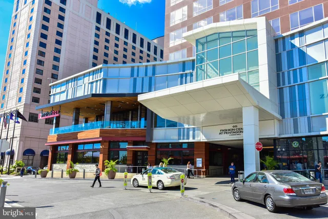 a view of a patio with a table and chairs