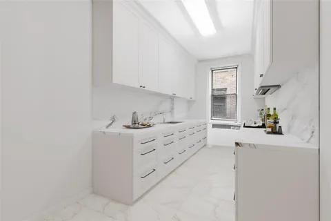 a kitchen with cabinets and appliances
