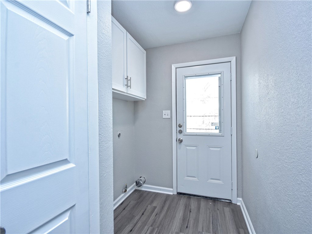 2302 Fuzz Fairway, Unit B Austin, TX 78728 - Photo 12 of 27 Laundry room with full-size connections. Located just on the opposite side of the Kitchen. New exterior door to the private back yard.