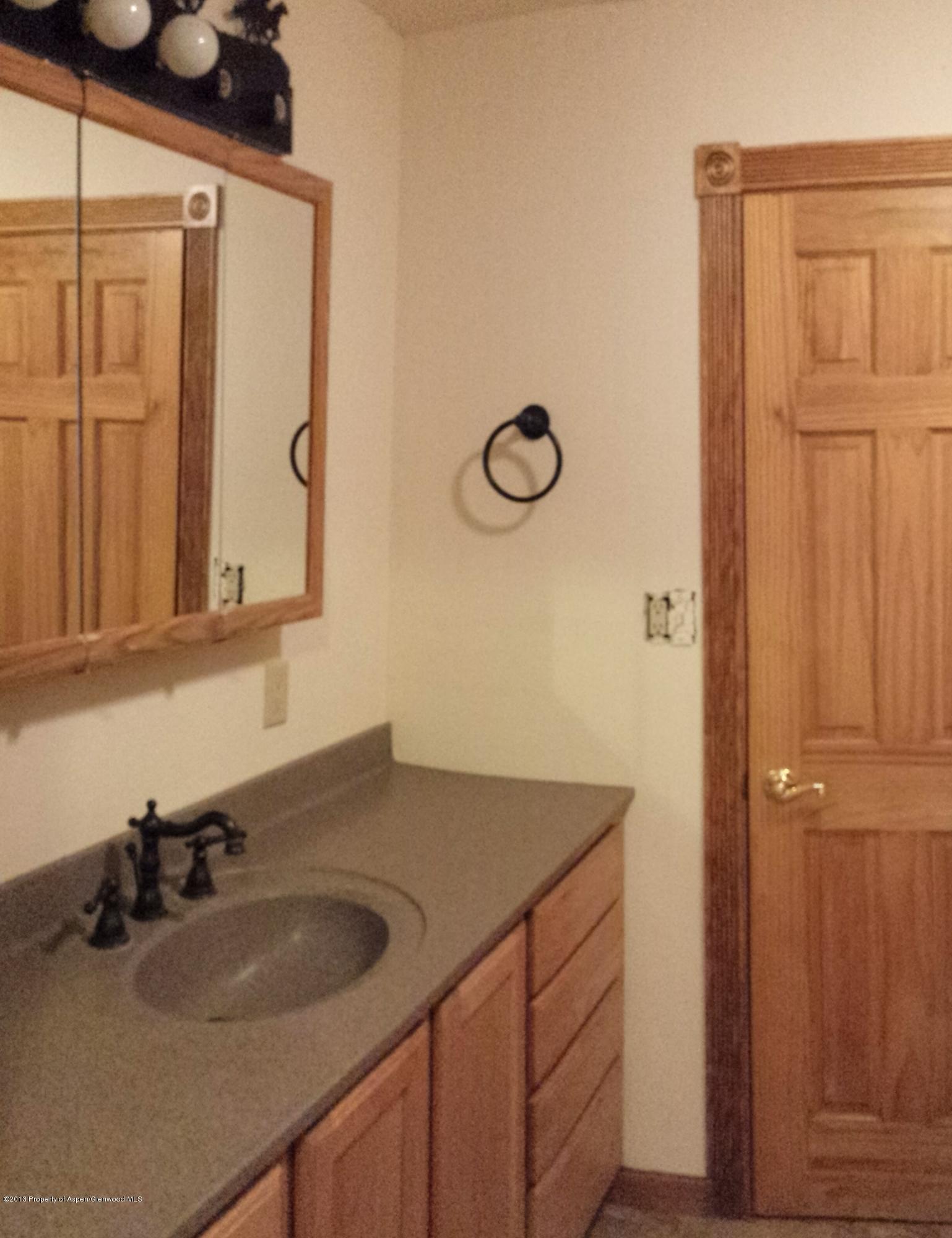115 Will Rifle, CO 81650 - Photo 4 of 11 a bathroom with a sink and a mirror