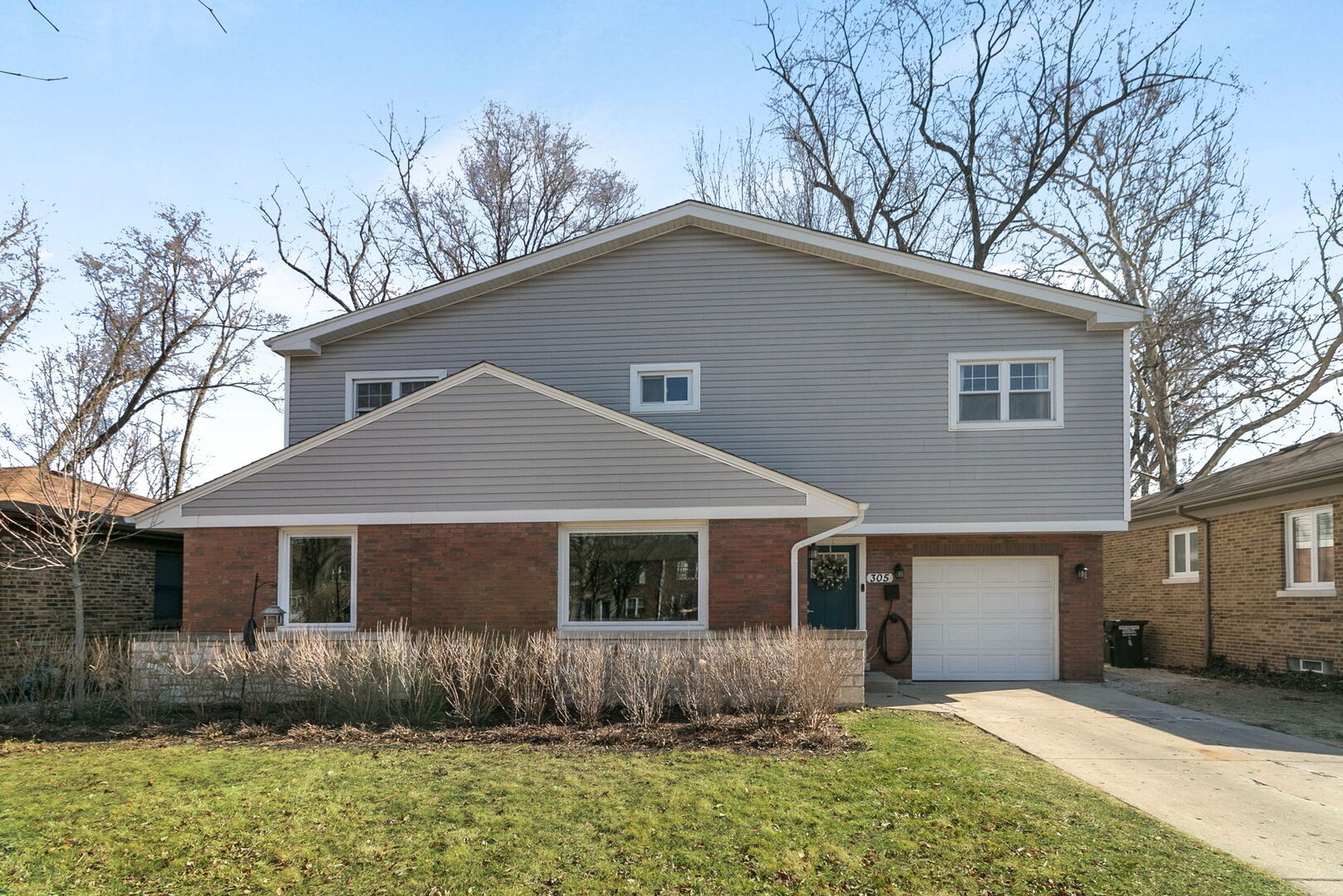 305 Des Plaines Avenue Riverside, IL 60546 - Photo 1 of 1 a front view of a house with garden