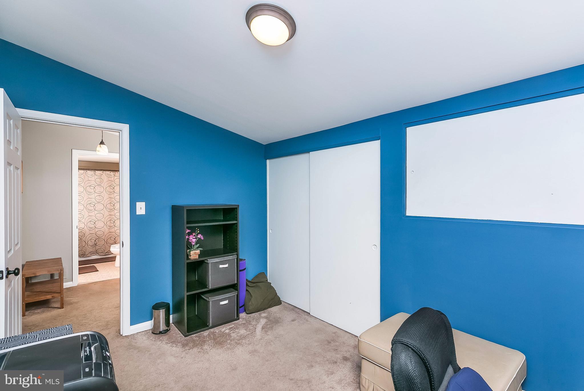 7313 Campfield Road Baltimore, MD 21208 - Photo 11 of 19 a bedroom with furniture and a window