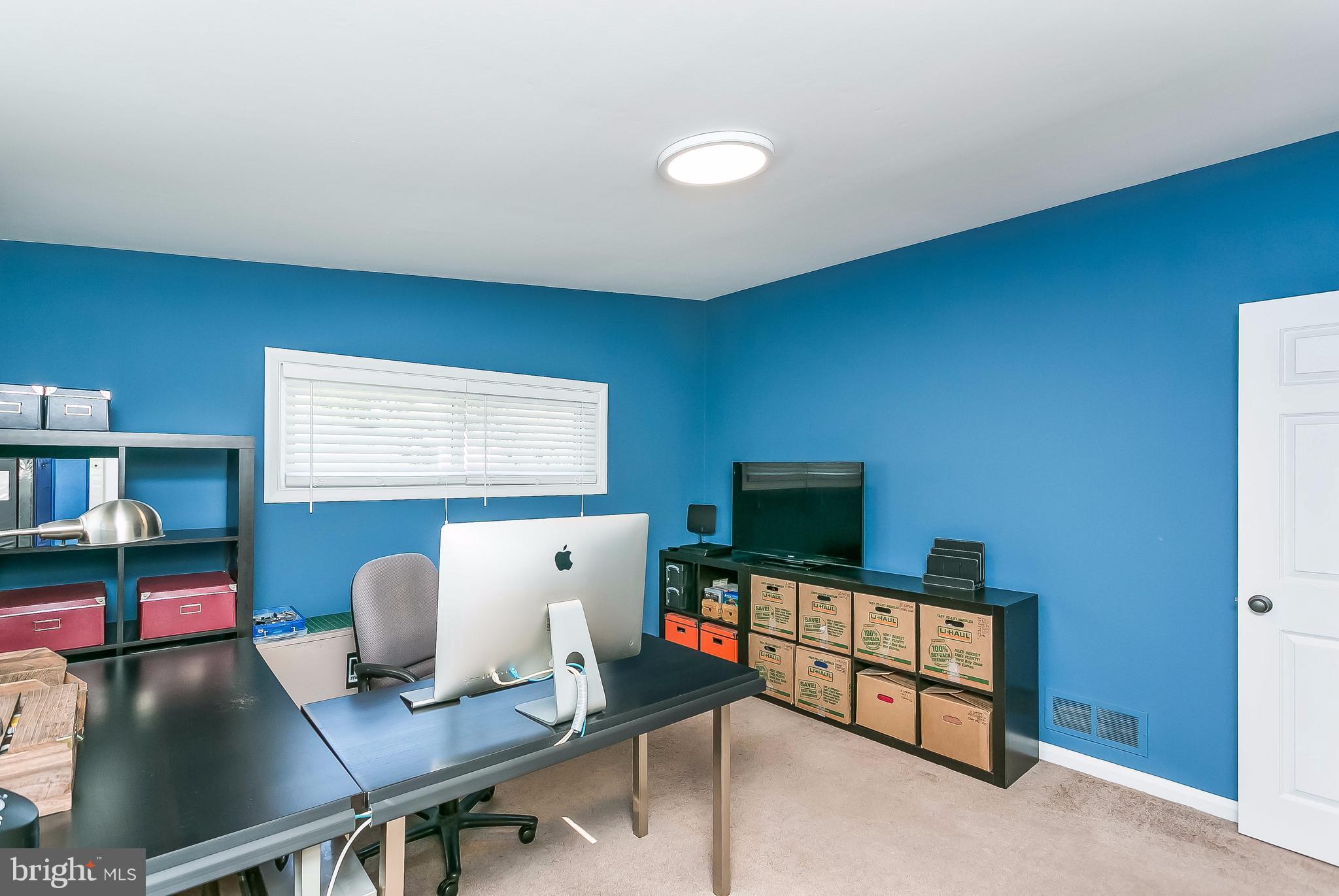 7313 Campfield Road Baltimore, MD 21208 - Photo 14 of 19 a room with furniture and a flat screen tv