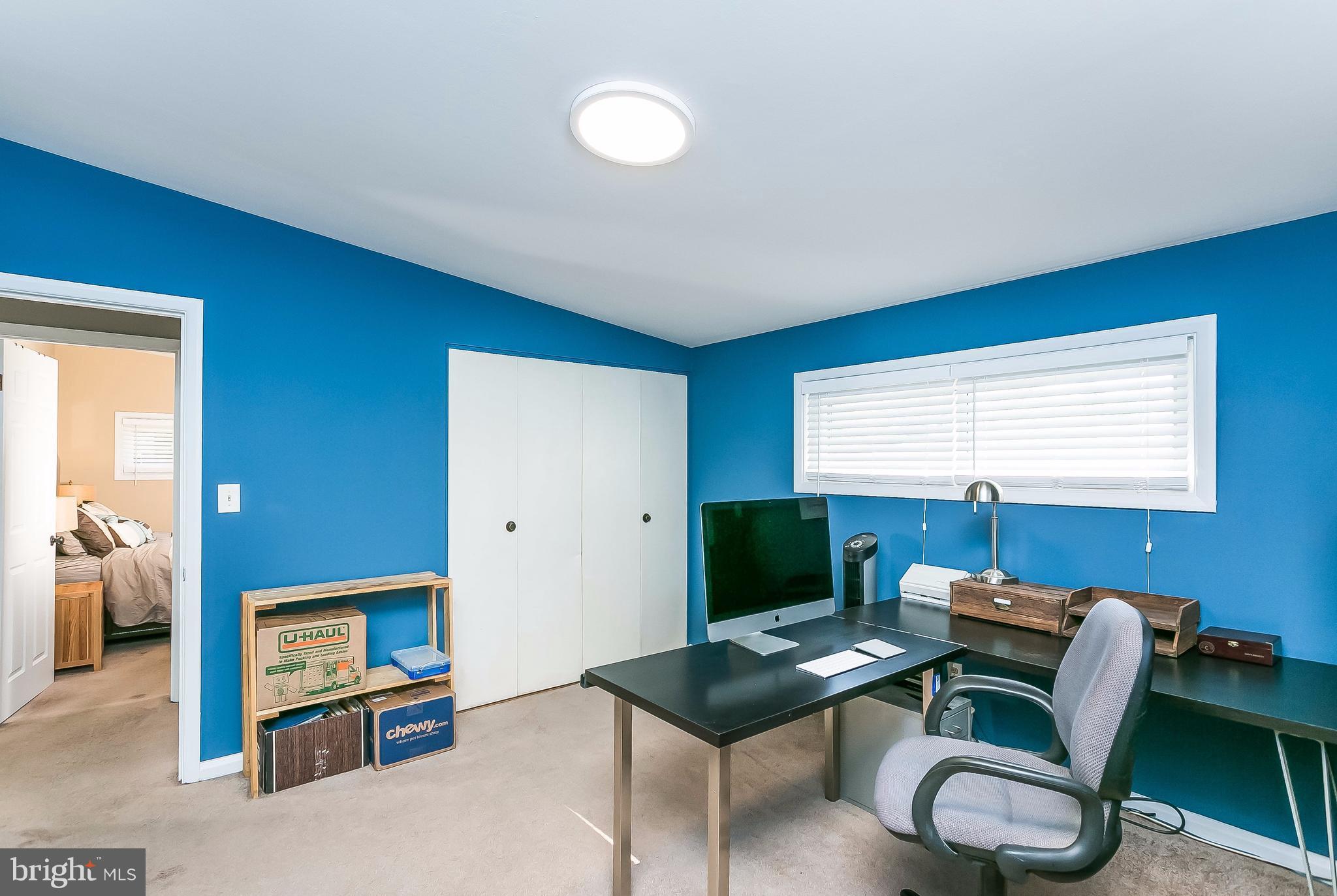 7313 Campfield Road Baltimore, MD 21208 - Photo 15 of 19 a view of a workspace with furniture