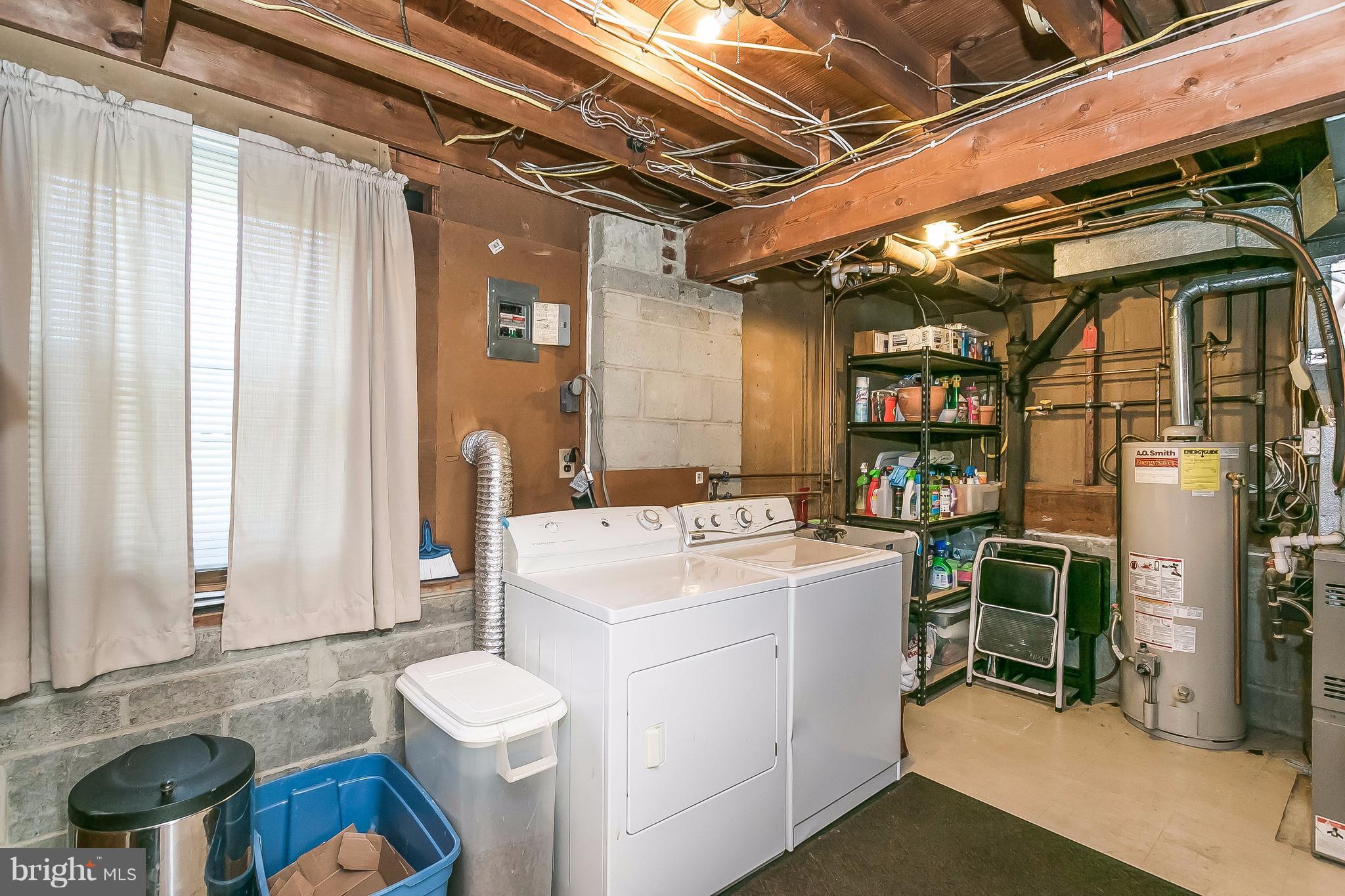 7313 Campfield Road Baltimore, MD 21208 - Photo 17 of 19 a utility room with dryer and washer