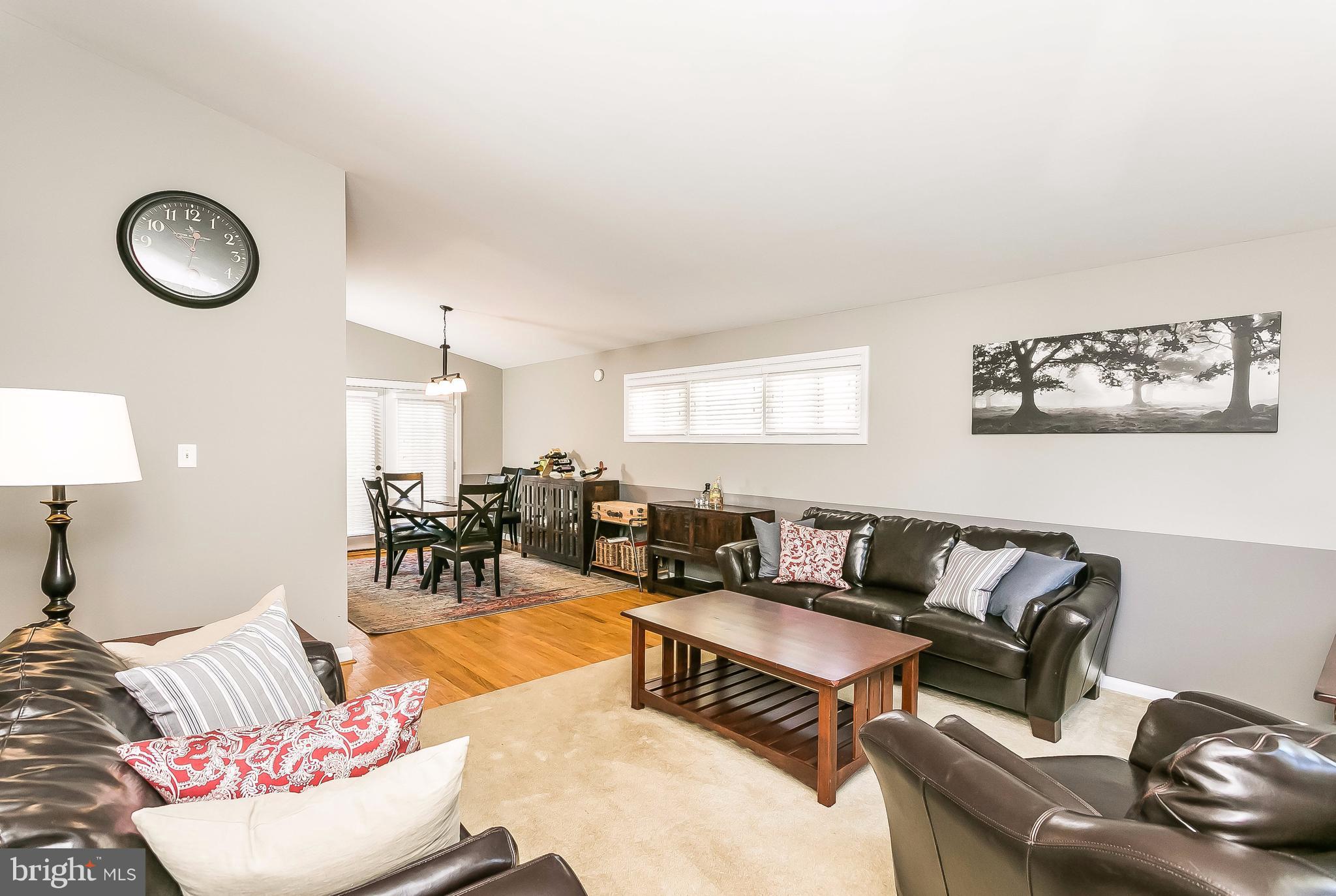 7313 Campfield Road Baltimore, MD 21208 - Photo 3 of 19 a living room with furniture and wooden floor