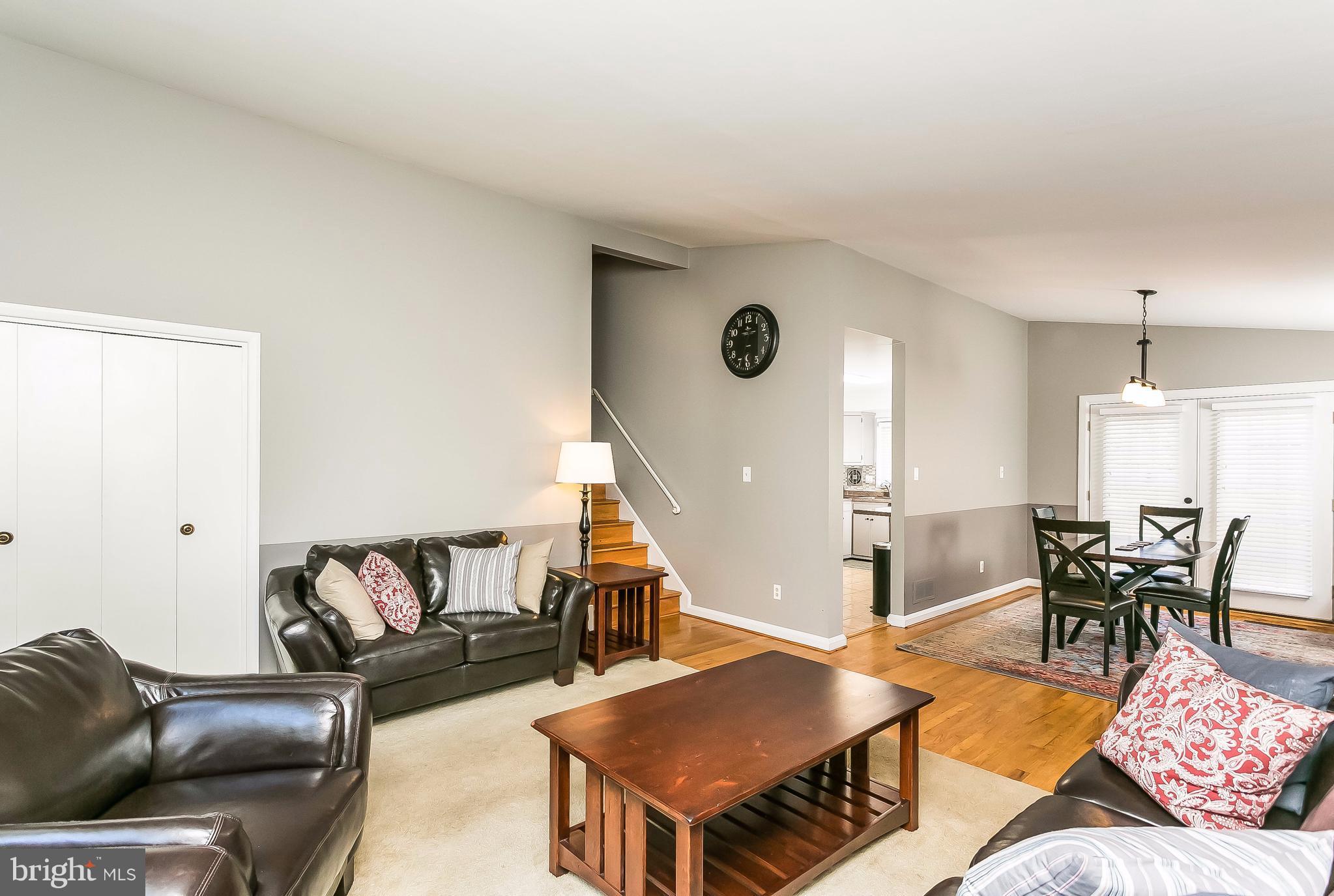 7313 Campfield Road Baltimore, MD 21208 - Photo 4 of 19 a living room with furniture and wooden floor