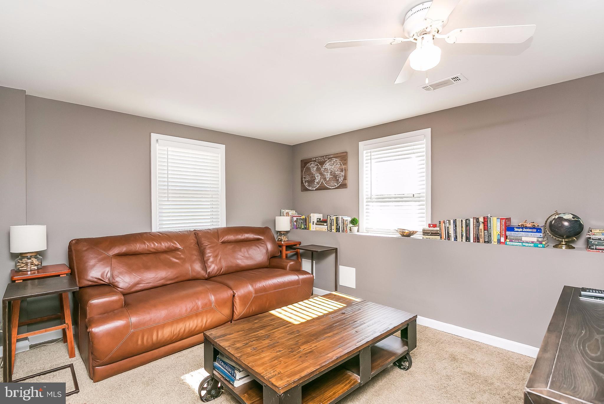7313 Campfield Road Baltimore, MD 21208 - Photo 7 of 19 a living room with furniture and a window