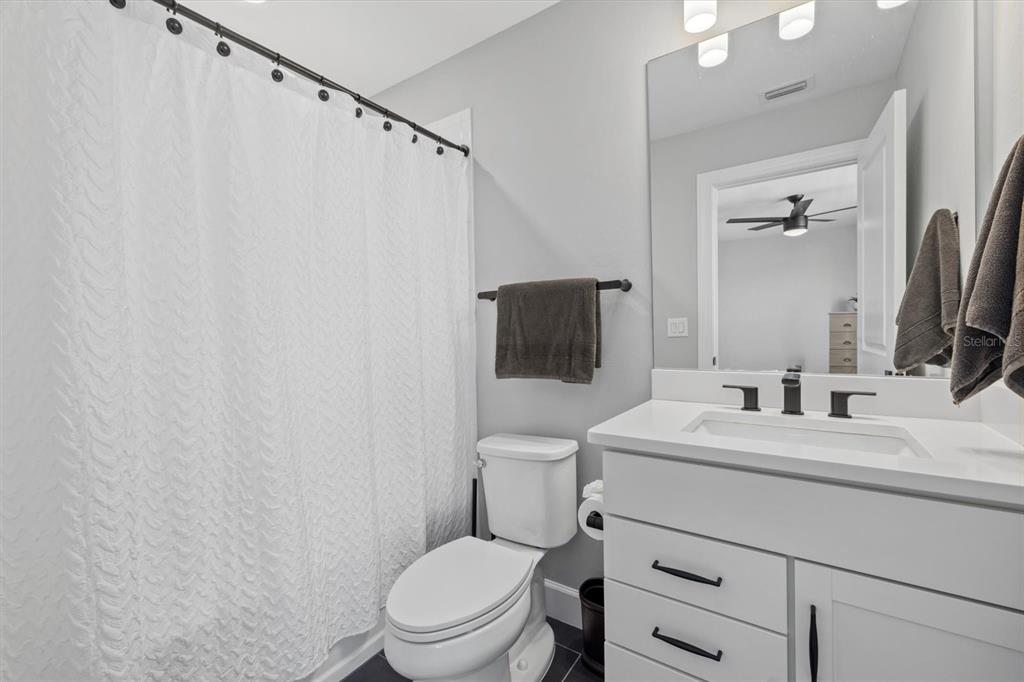 3508 Anchor Bay Trail Lakewood Ranch, FL 34211 - Photo 29 of 74 a bathroom with a toilet a sink and a mirror