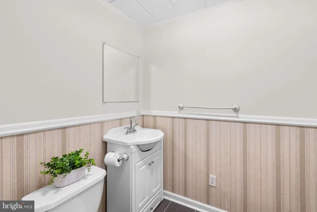 a view of a room with wooden floor and cabinet