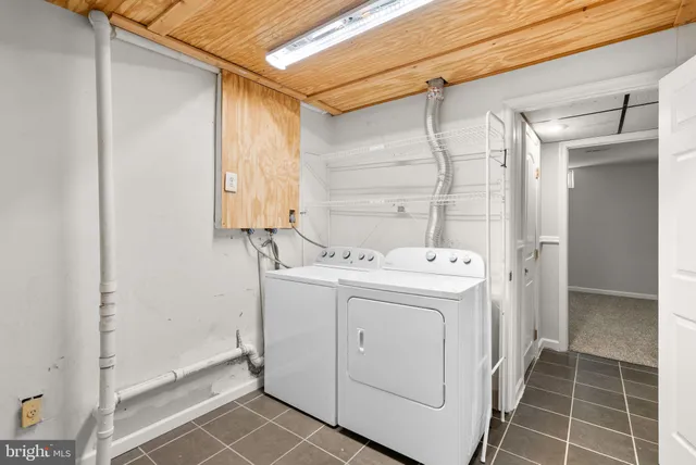 a room with furniture and large windows