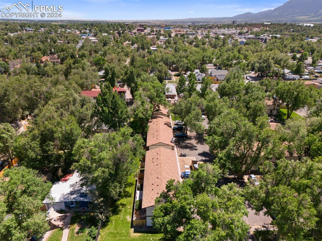 757 Alexander Road, Unit C Colorado Springs, CO 80909 - Photo 27 of 29 Drone / aerial view featuring a mountain view