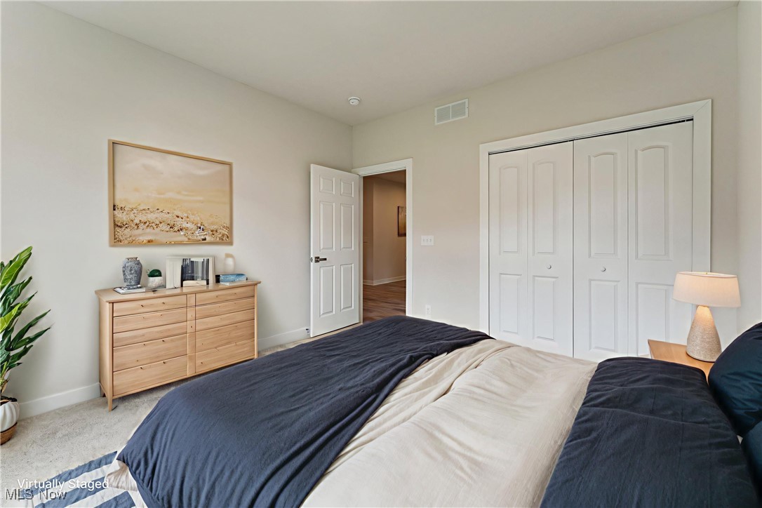 7605 Lake Road East Madison, OH 44057 - Photo 27 of 50 Virtual staging: Bedroom with baseboards, carpet, and a closet