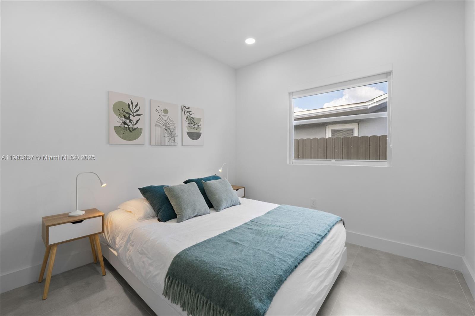 4301 Northwest 4th Street, Unit B Miami, FL 33126 - Photo 12 of 46 a bedroom with a bed and a window