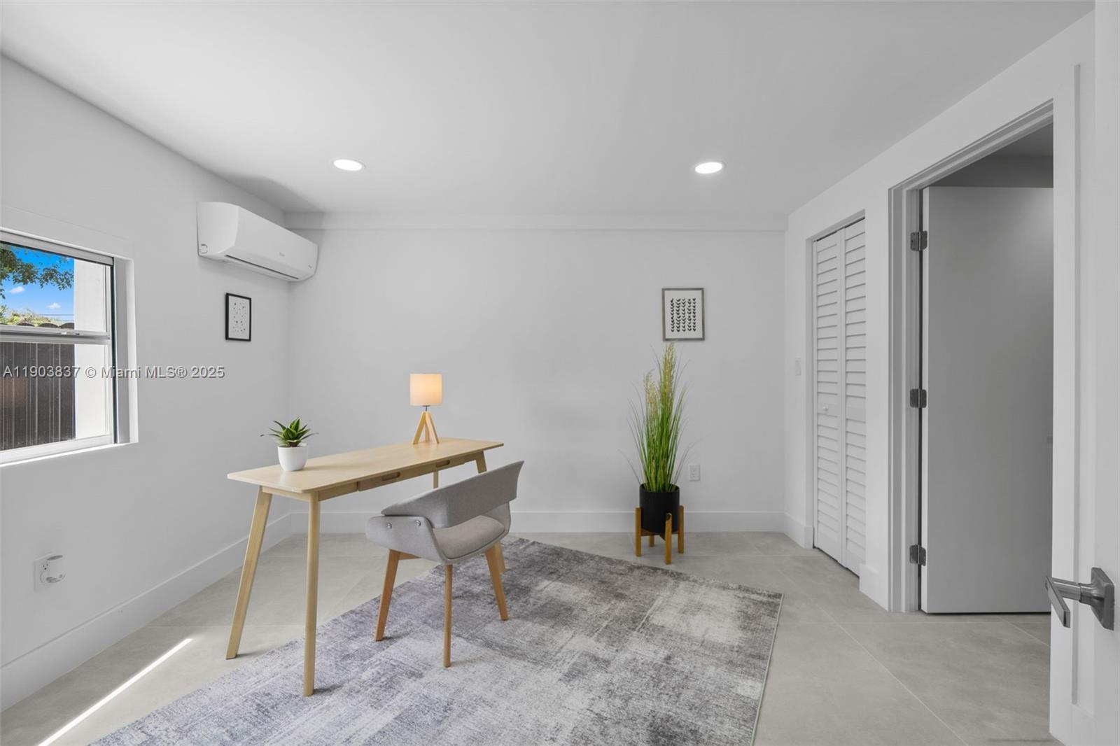 4301 Northwest 4th Street, Unit B Miami, FL 33126 - Photo 15 of 46 a workspace with furniture and window