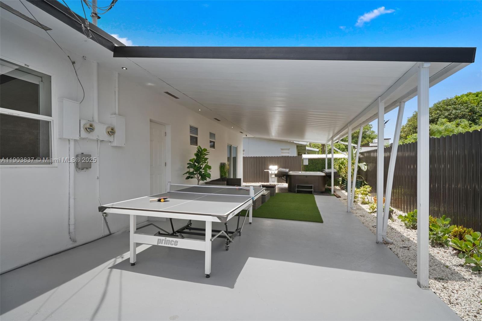 4301 Northwest 4th Street, Unit B Miami, FL 33126 - Photo 20 of 46 a room with furniture and a flat screen tv