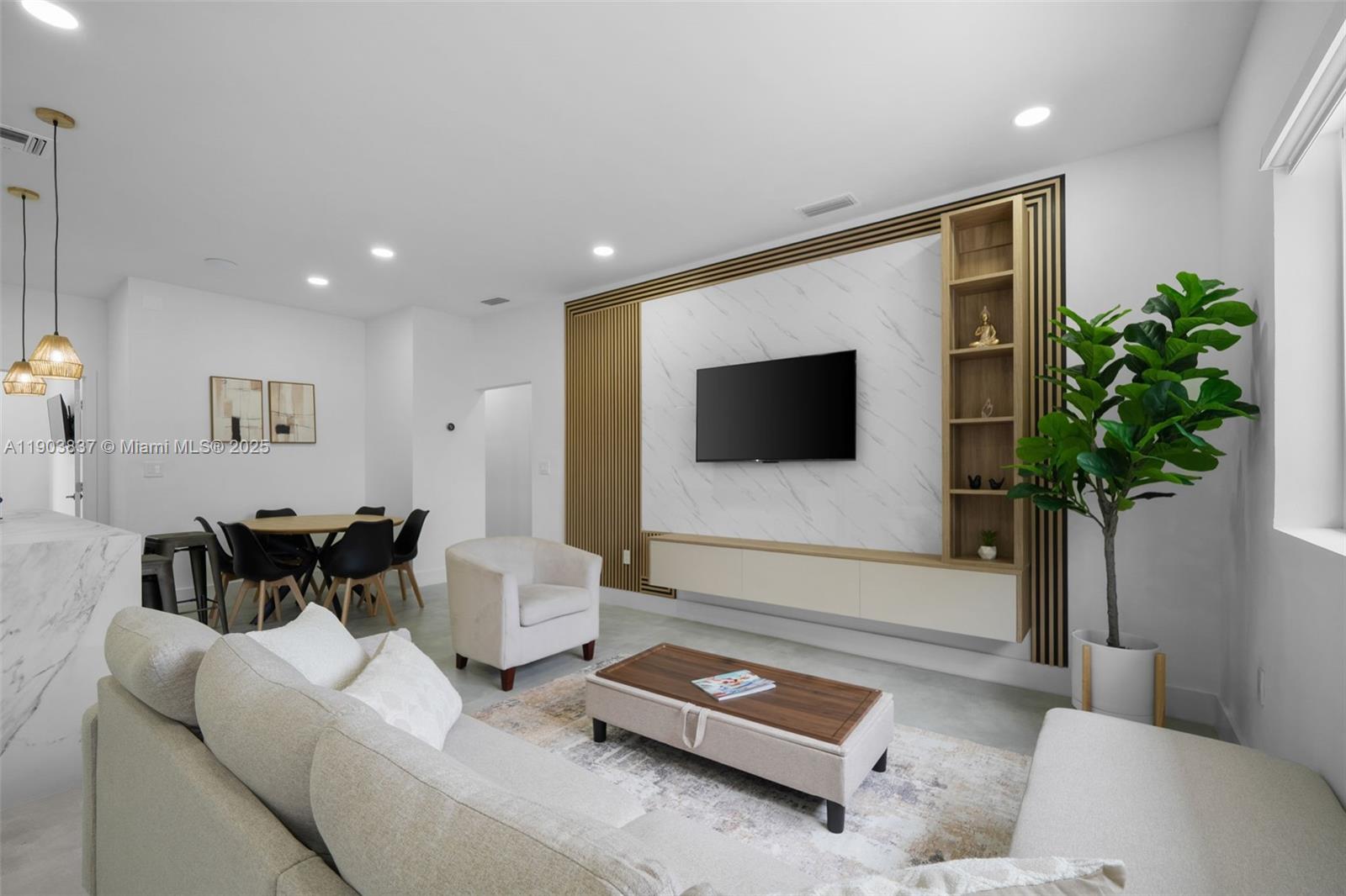 4301 Northwest 4th Street, Unit B Miami, FL 33126 - Photo 2 of 46 a living room with furniture and a flat screen tv