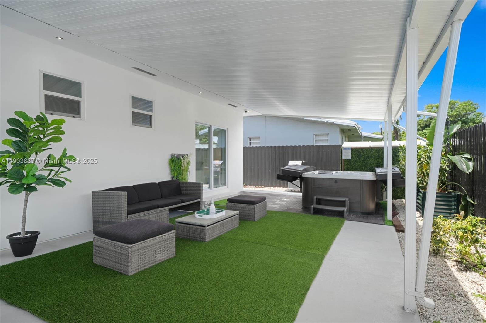 4301 Northwest 4th Street, Unit B Miami, FL 33126 - Photo 21 of 46 a living room with furniture potted plant and a window