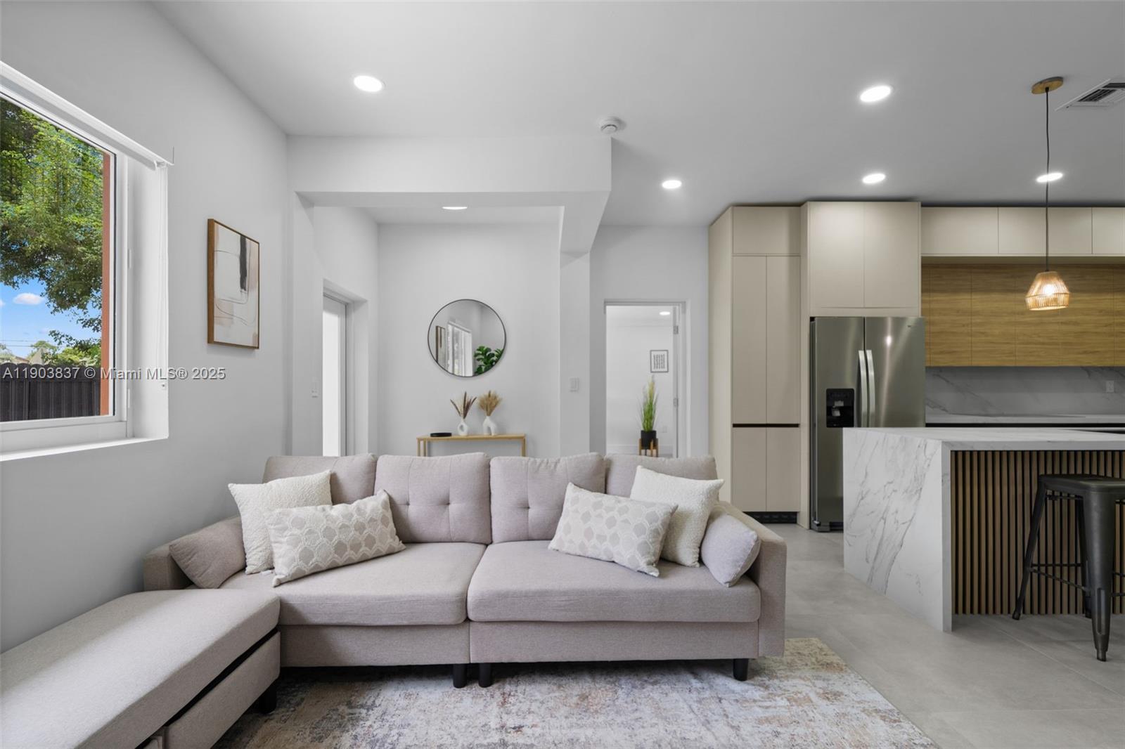 4301 Northwest 4th Street, Unit B Miami, FL 33126 - Photo 22 of 46 a living room with furniture and a large window