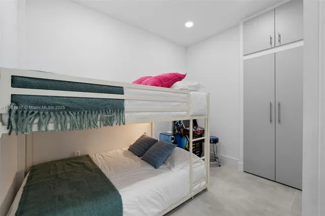 a bedroom with a bed and a closet