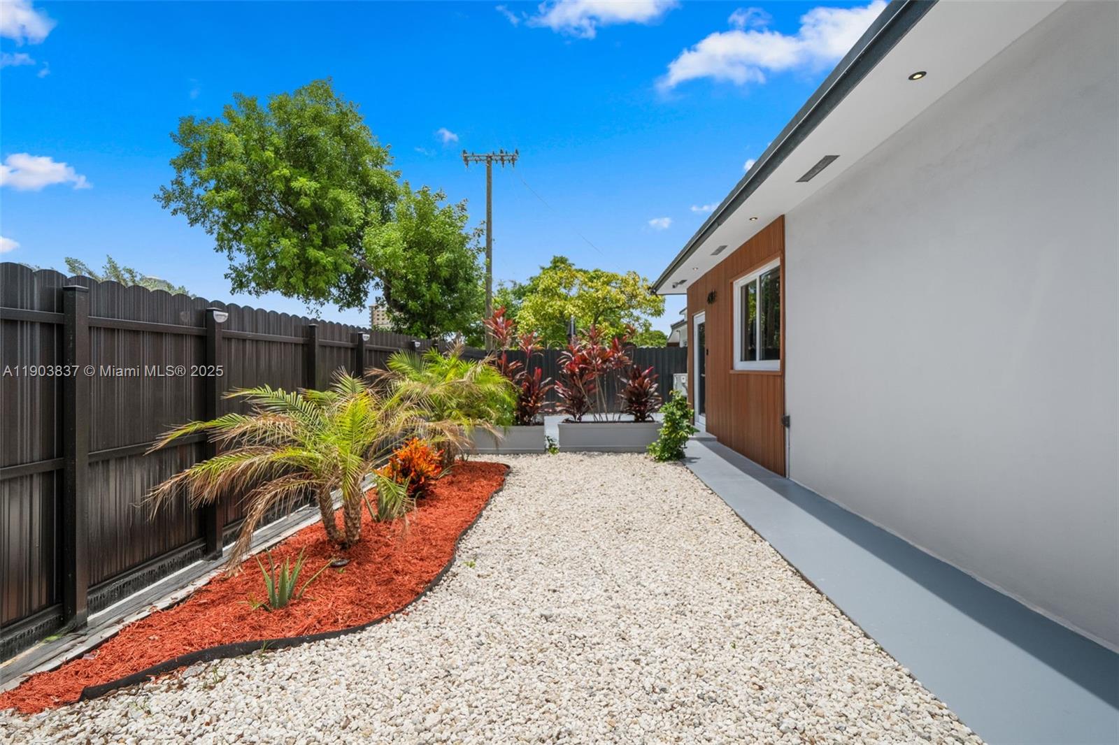 4301 Northwest 4th Street, Unit B Miami, FL 33126 - Photo 44 of 46 a view of a backyard with plants