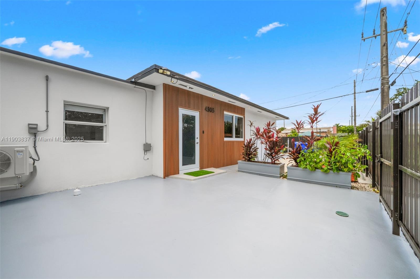 4301 Northwest 4th Street, Unit B Miami, FL 33126 - Photo 46 of 46 a view of a house with a garage