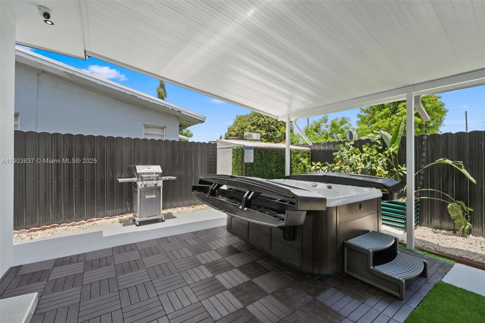 4301 Northwest 4th Street, Unit B Miami, FL 33126 - Photo 7 of 46 a view of outdoor space kitchen and patio