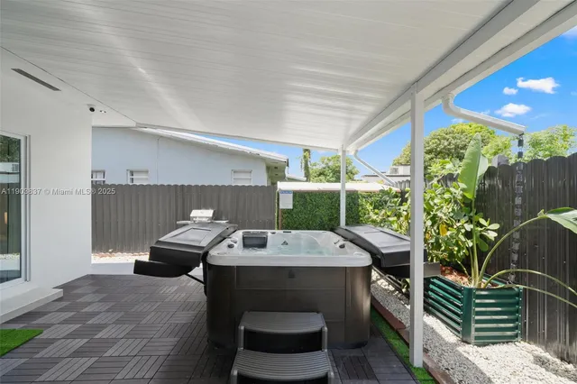 a outdoor space with a couch and chairs