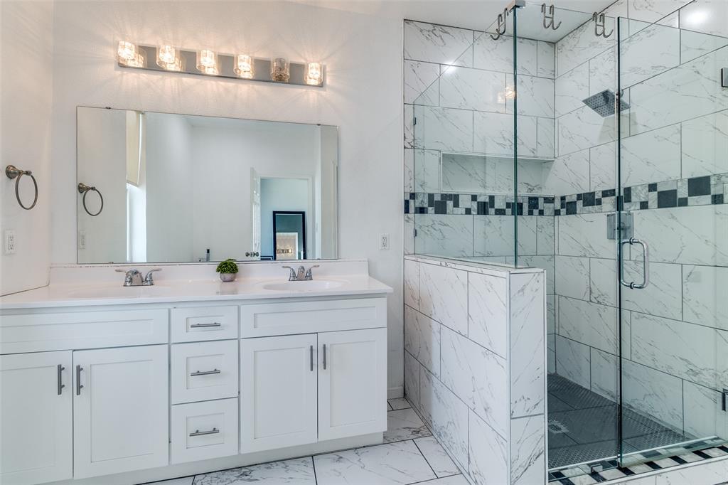 3121 Rutz Street Dallas, TX 75212 - Photo 16 of 24 a bathroom with a double vanity sink and mirror