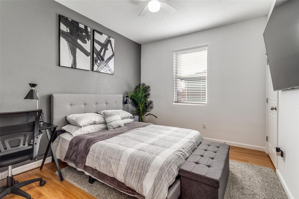 3121 Rutz Street Dallas, TX 75212 - Photo 21 of 24 a bedroom with a bed and a window